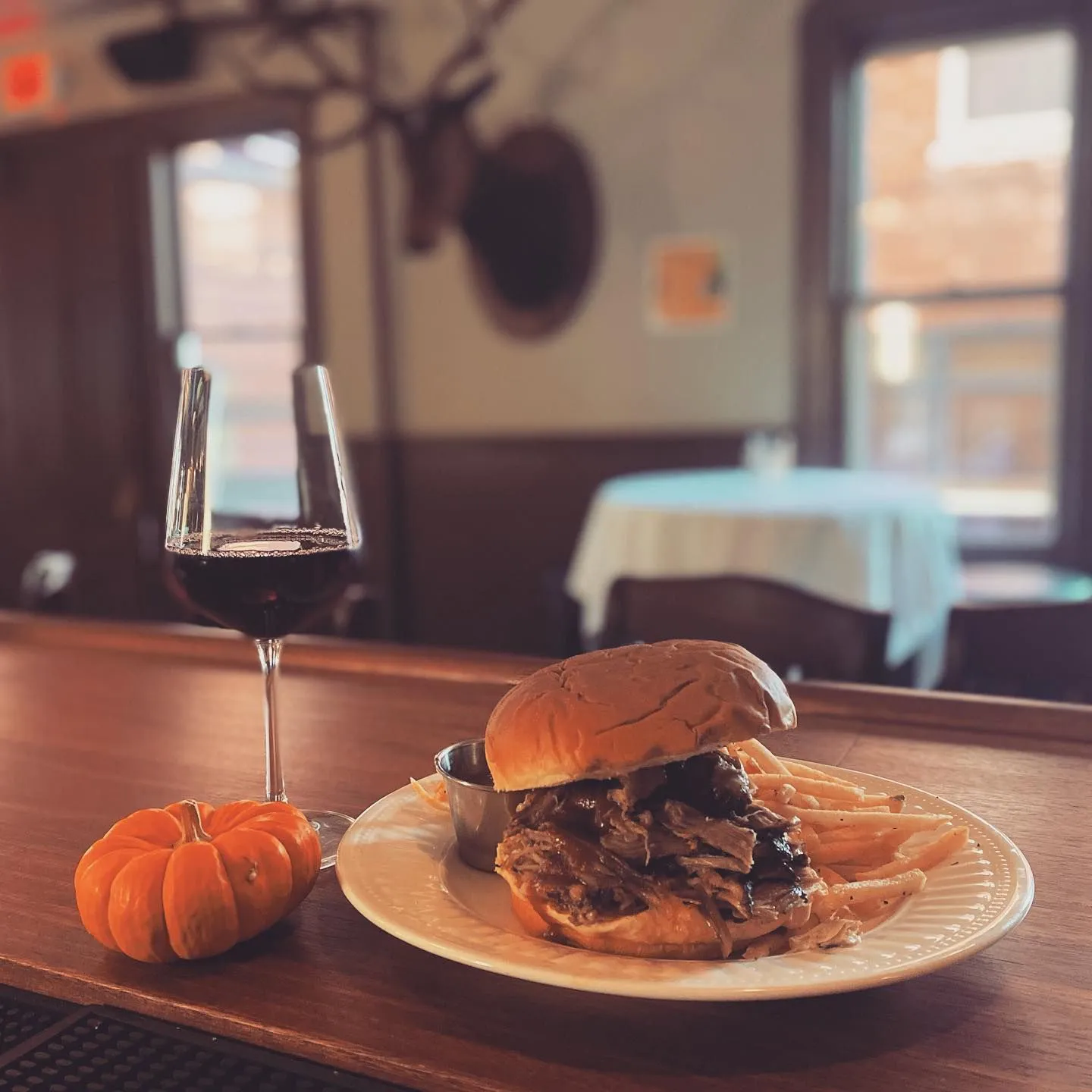 Photo of a burger and wine