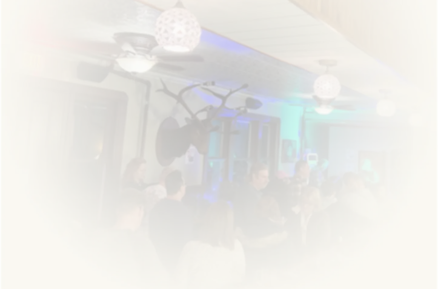 Background photo of people at the bar area of The Social